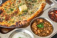 Tandoori Aloo Kulcha With Punjabi Chole And Raita