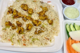 Chicken Fried Rice With Salad, Raita And Ketchup