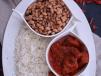 Rice And Beans With Goat Meat And Sauce