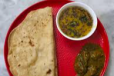 MUTTON SET WITH KHATTI DAL and ROMALI ROTI