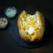 Baked potato with yogurt and corn