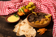 Meat Steak With Potatoes And Garlic And Lemon