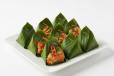 Steamed chicken wrapped in banana leaves