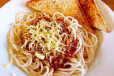 Filipino Style Spaghetti With 2 Slices Of Garlic Bread