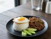 Rice topped with egg and basil