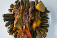 Mandi meat with grape leaves