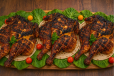 Three charcoal-grilled chickens