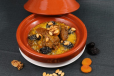 Lamb Tajine With Prunes And Almond, Sesame, Onions On Charcoal
