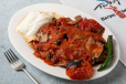 Et Iskender (Meat Doner over Bread with Yogurt and Sauce)