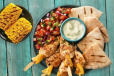 Chicken and Pineapple Skewers, Pita and Fresh Salsa + 1 regular side