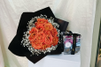orange bouquet with chocolate in acrylic box