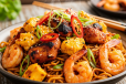 Egg, Chicken Tikka and Prawns Schezwan Noodles